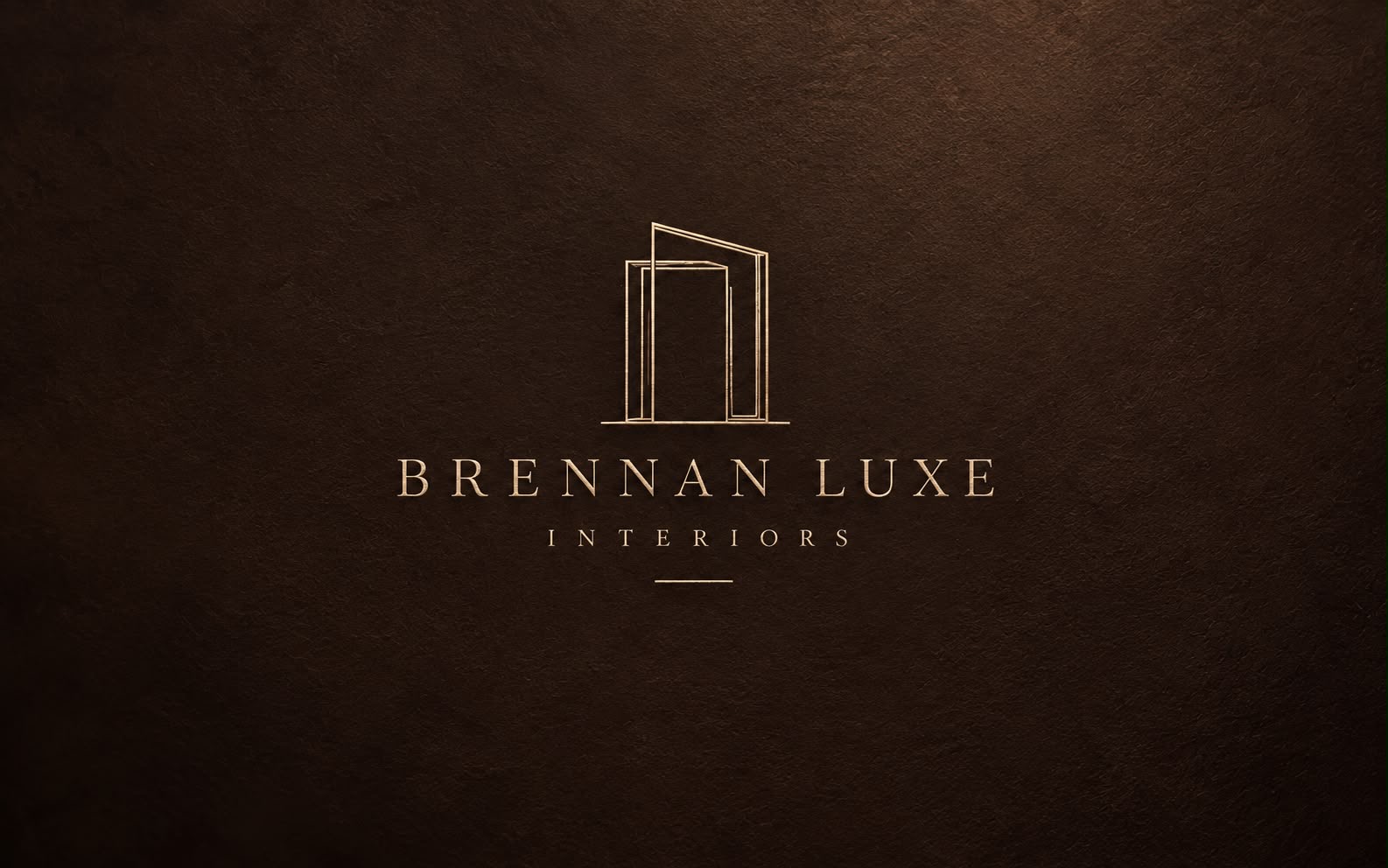 Official Brennan Luxe Interiors logo with gold architectural emblem and lettering on a dark espresso background